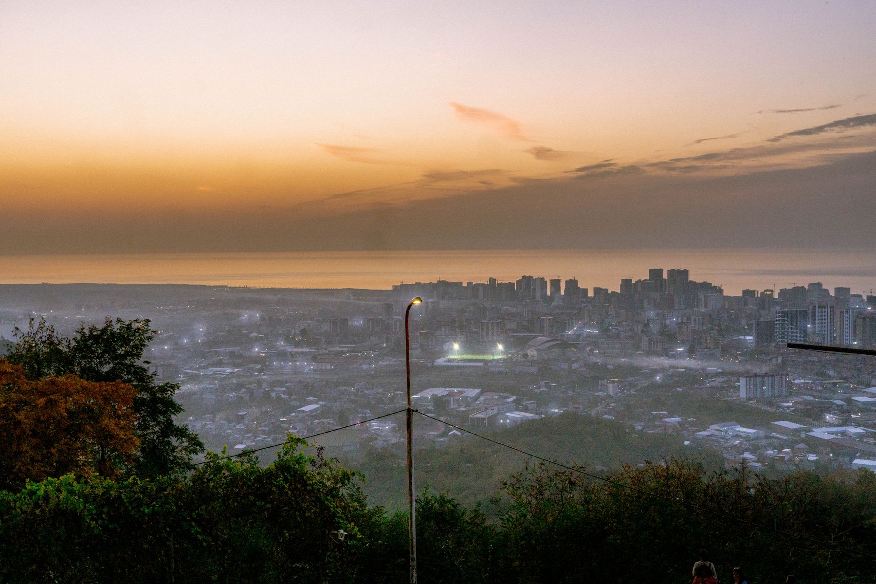 A soft sunset over the city and Black Sea in Batumi